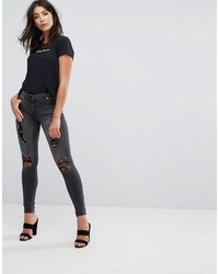 dunkelgraue enge Jeans mit Destroyed-Effekten