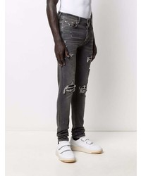 dunkelgraue enge Jeans mit Destroyed-Effekten von Amiri