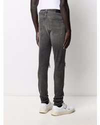 dunkelgraue enge Jeans mit Destroyed-Effekten von Amiri