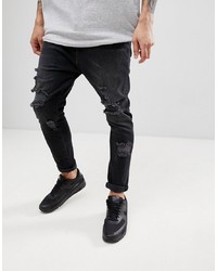 dunkelgraue Jeans mit Destroyed-Effekten von ASOS DESIGN