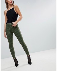 dunkelgrüne vertikal gestreifte enge Jeans