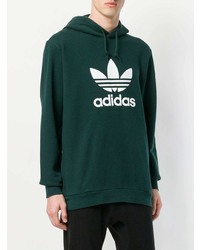 dunkelgrüner bedruckter Pullover mit einem Kapuze von adidas