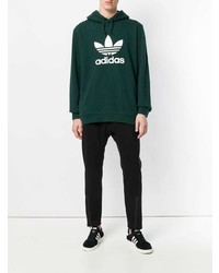 dunkelgrüner bedruckter Pullover mit einem Kapuze von adidas