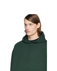 dunkelgrüner Pullover mit einem Kapuze von Balenciaga