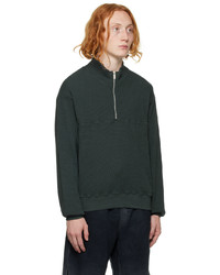 dunkelgrüner Pullover mit einem Reißverschluss am Kragen von Cotton Citizen