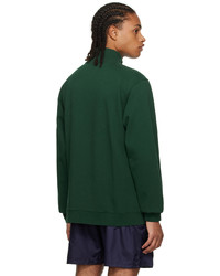 dunkelgrüner Pullover mit einem Reißverschluss am Kragen von Palmes