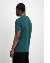 dunkelgrünes T-Shirt mit einem Rundhalsausschnitt von Alpha Industries