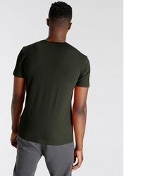 dunkelgrünes T-Shirt mit einem Rundhalsausschnitt von Vans