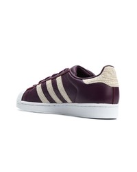 dunkellila Leder niedrige Sneakers von adidas