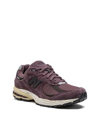 dunkellila niedrige Sneakers von New Balance