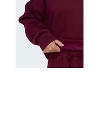 dunkelroter Pullover mit einer Kapuze von adidas Sportswear