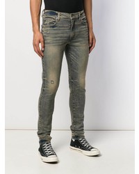 dunkeltürkise enge Jeans mit Destroyed-Effekten von Amiri