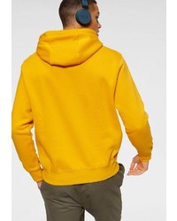 gelber Pullover mit einem Kapuze von Nike Sportswear