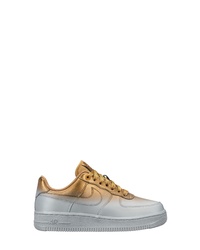 goldene bedruckte niedrige Sneakers