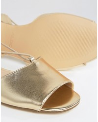 goldene flache Sandalen von Aldo