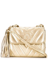 goldene horizontal gestreifte Umhängetasche von Chanel