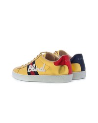 goldene niedrige Sneakers von Gucci