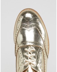 goldene Schuhe von London Rebel