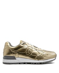 goldene Sportschuhe von Saucony