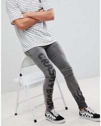 graue bedruckte enge Jeans von ASOS DESIGN