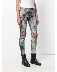 graue enge Jeans mit Acid-Waschung von Amiri