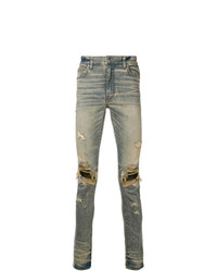 graue enge Jeans mit Destroyed-Effekten von Amiri