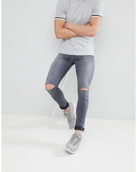 graue enge Jeans mit Destroyed-Effekten von ASOS DESIGN