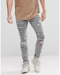 graue enge Jeans mit Destroyed-Effekten von ASOS DESIGN