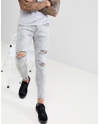 graue enge Jeans mit Destroyed-Effekten von Bershka