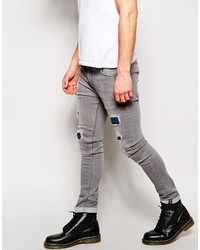 graue enge Jeans mit Destroyed-Effekten von Asos