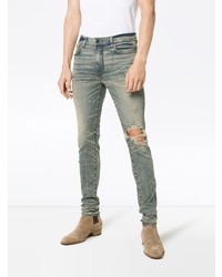 graue enge Jeans mit Destroyed-Effekten von Amiri