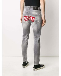 graue enge Jeans mit Destroyed-Effekten von John Richmond