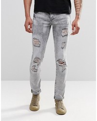 graue enge Jeans mit Destroyed-Effekten