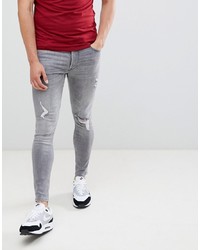 graue enge Jeans mit Destroyed-Effekten von Gym King