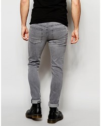 graue enge Jeans mit Destroyed-Effekten von Cheap Monday
