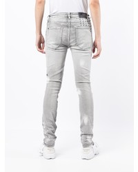 graue enge Jeans mit Destroyed-Effekten von Ksubi