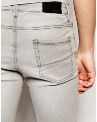 graue enge Jeans mit Destroyed-Effekten von Pull&Bear