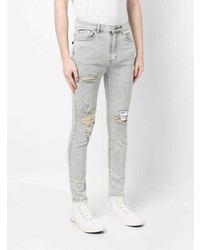 graue enge Jeans mit Destroyed-Effekten von Musium Div.