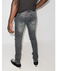 graue enge Jeans mit Destroyed-Effekten von Ksubi