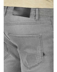 graue enge Jeans mit Destroyed-Effekten von Solid