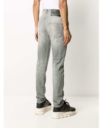 graue enge Jeans mit Destroyed-Effekten von John Richmond