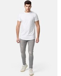 graue enge Jeans mit Destroyed-Effekten von Tazzio