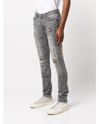 graue enge Jeans mit Destroyed-Effekten von Ksubi