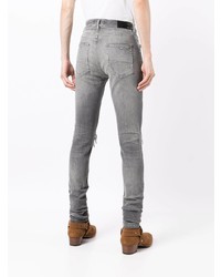 graue enge Jeans mit Destroyed-Effekten von Amiri