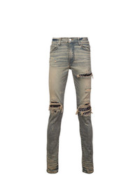 graue Jeans mit Destroyed-Effekten von Amiri