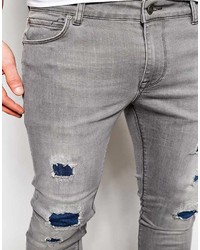 graue Jeans mit Destroyed-Effekten von Asos