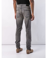 graue Jeans mit Destroyed-Effekten von Amiri