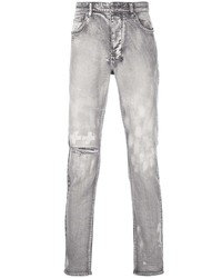 graue Jeans mit Destroyed-Effekten von Ksubi
