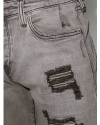 graue Jeans mit Destroyed-Effekten von True Religion