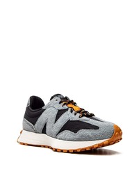 graue Sportschuhe von New Balance